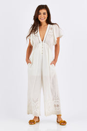 Model Chesska wearing size S of the Blackpool Jumpsuit in colour White (White), from the front, showing the whole outfit