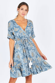 Model Madeline wearing the Boardwalk Dress in colour Havana (Blue), from the front, cropped image