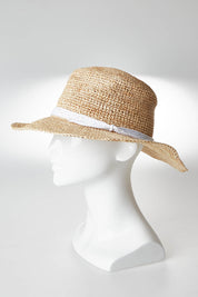 A model wearing size OneSize of the Mentana Hat in colour Natwhite (White), from the front, showing the whole outfit