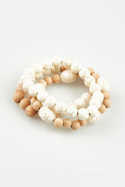 A model wearing the Madrid Bracelet in colour Bracelets, from the front, showing the whole outfit
