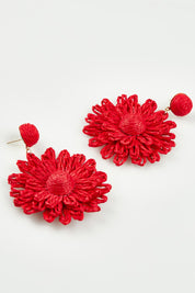 A model wearing the Bianca Earrings in colour Red (Red), from the front, showing the whole outfit
