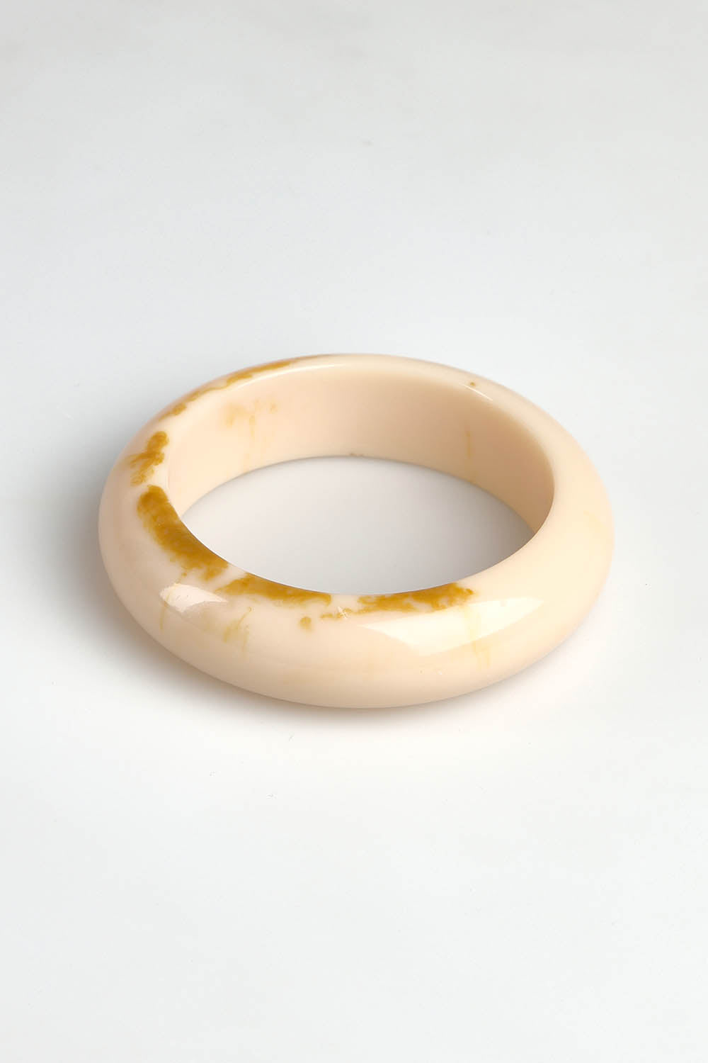 A model wearing the Bower Bangle in colour Natural, from the front, showing the whole outfit