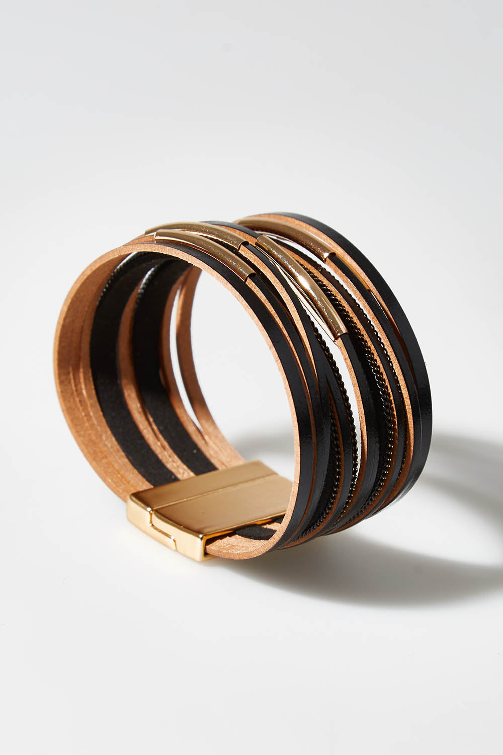 A model wearing size OneSize of the Ainsley Bracelet in colour Blackgold (Black), from the front, showing the whole outfit