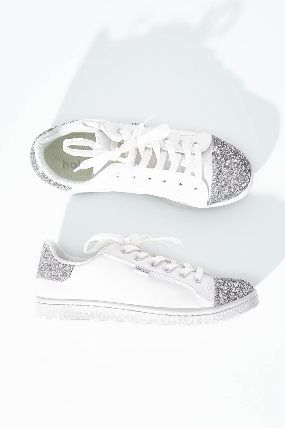 A model wearing size 6 of the Stardust Sneaker in colour White (White), from the front, showing the whole outfit