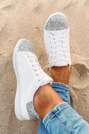 A model wearing the Stardust Sneaker in colour White (White), from the front, showing the whole outfit