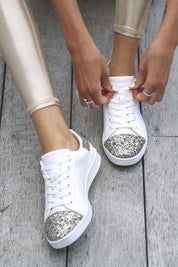 A model wearing the Stardust Sneaker in colour White (White), from the front, showing the whole outfit