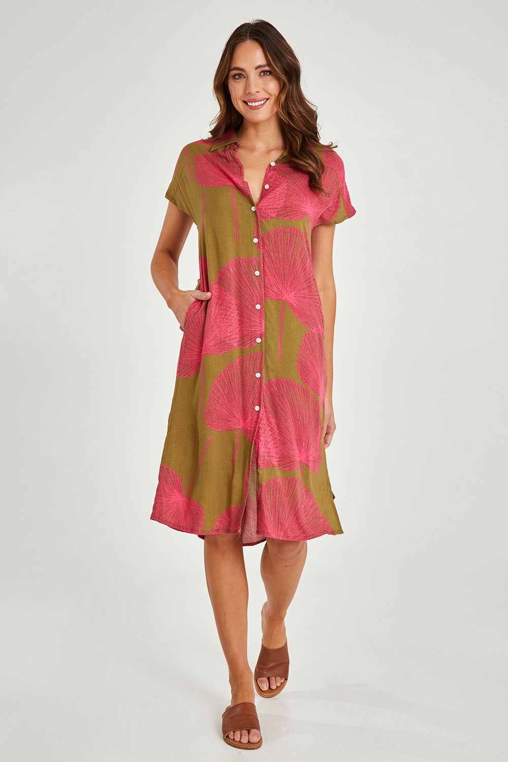 Model Madeline wearing size 10 of the Calforniai Dress in colour Fantasia (Green), from the front, showing the whole outfit