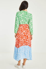 Model Stacey wearing size 10 of the Margarita Long Sleeve Dress in colour Provence (Green), from the back