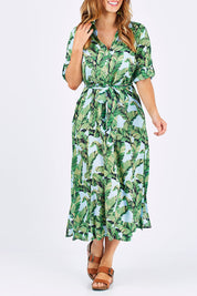 Model Laura wearing size M of the Patsy Dress in colour PapBlue (Blue), from the front, cropped image