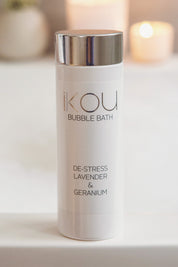 A model wearing the De Stress Bubble Bath in colour Destress (White), from the front, showing the whole outfit