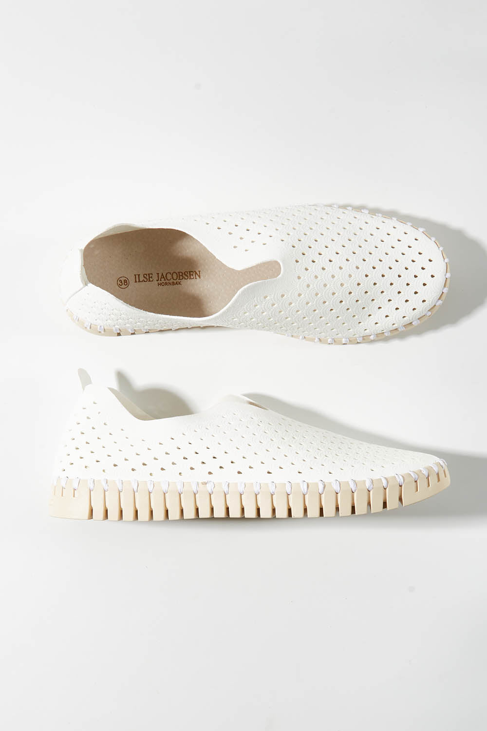 A model wearing size 36 of the Tulip Sneaker in colour White (White), from the front, showing the whole outfit