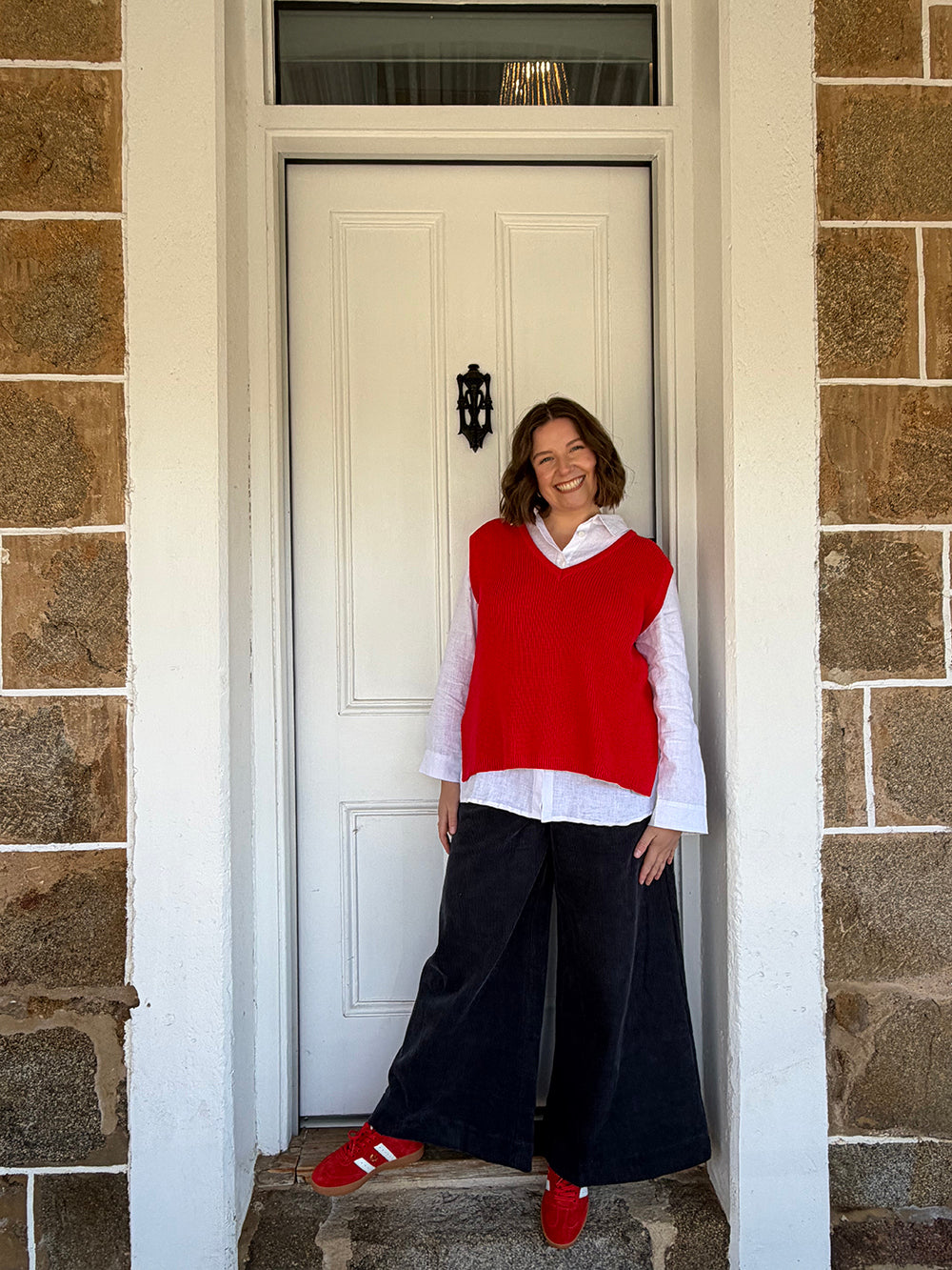Red Vest Styled With Navy Cord Pants