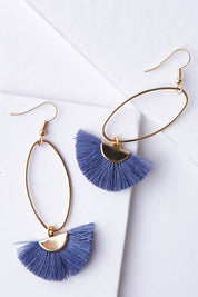 A model wearing size OneSize of the Caprioska Tassel Earrings in colour BlueSmoke (Blue), from the front, showing the whole outfit