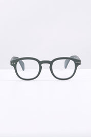 A model wearing size 1 of the Square Reading Glasses in colour Khakigreen (Green), from the front, showing the whole outfit