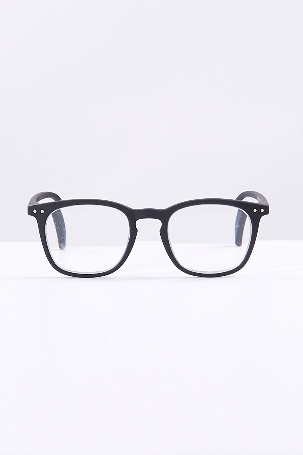 A model wearing size 1 of the E Rectangular Reading Glasses in colour Black (Black), from the front, showing the whole outfit