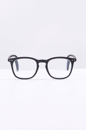 A model wearing size 1 of the E Rectangular Reading Glasses in colour Black (Black), from the front, showing the whole outfit