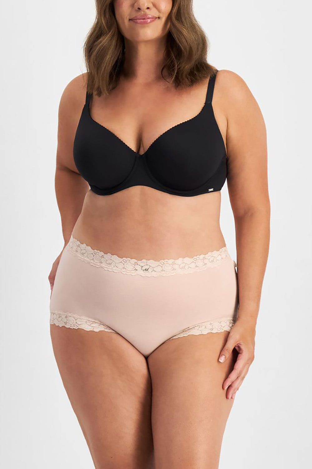 A model wearing the Parisienne Bamboo Full Brief in colour Dusk, from the front, cropped image