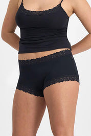 A model wearing the Parisienne Cotton Full Brief in colour Black (Black), from the front, cropped image