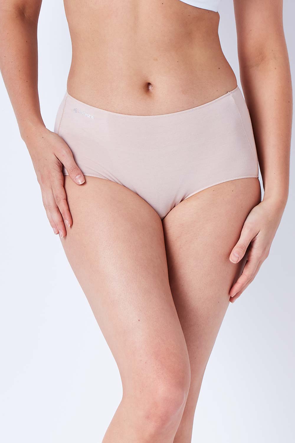 Model Phoebe wearing size 10 of the Bamboo Naturals Full Brief in colour Dusk, from the front, cropped image