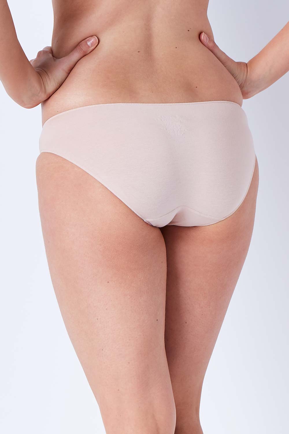 Model Phoebe wearing size 10 of the Bamboo Naturals Bikini Brief in colour Dusk, from the back
