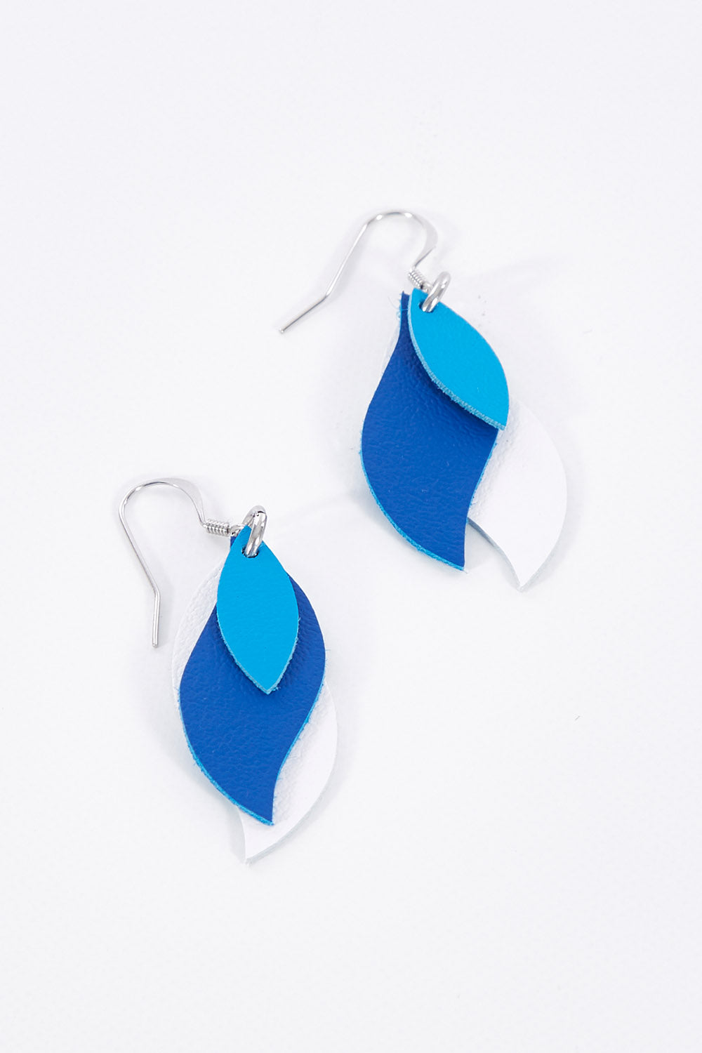 A model wearing size OneSize of the Australian Made Leather Leaf Earring in colour Bluewhite (Blue), from the front, showing the whole outfit