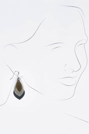 A model wearing size OneSize of the Australian Made Leather Teardrop Earring in colour Navy (Blue), from the front, showing the whole outfit
