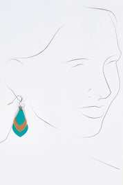 A model wearing size OneSize of the Australian Made Leather Teardrop Earring in colour Teal (Green), from the front, showing the whole outfit