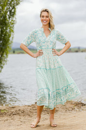 Model Alice wearing size 10 of the Emma Dress in colour Greencombo (Green), from the front, showing the whole outfit