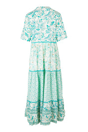 Product shot of the Emma Dress in colour Greencombo (Green), from the back