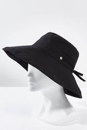 A model wearing the Ladies Upturn Noosa Hat in colour Black (Black), from the front, showing the whole outfit