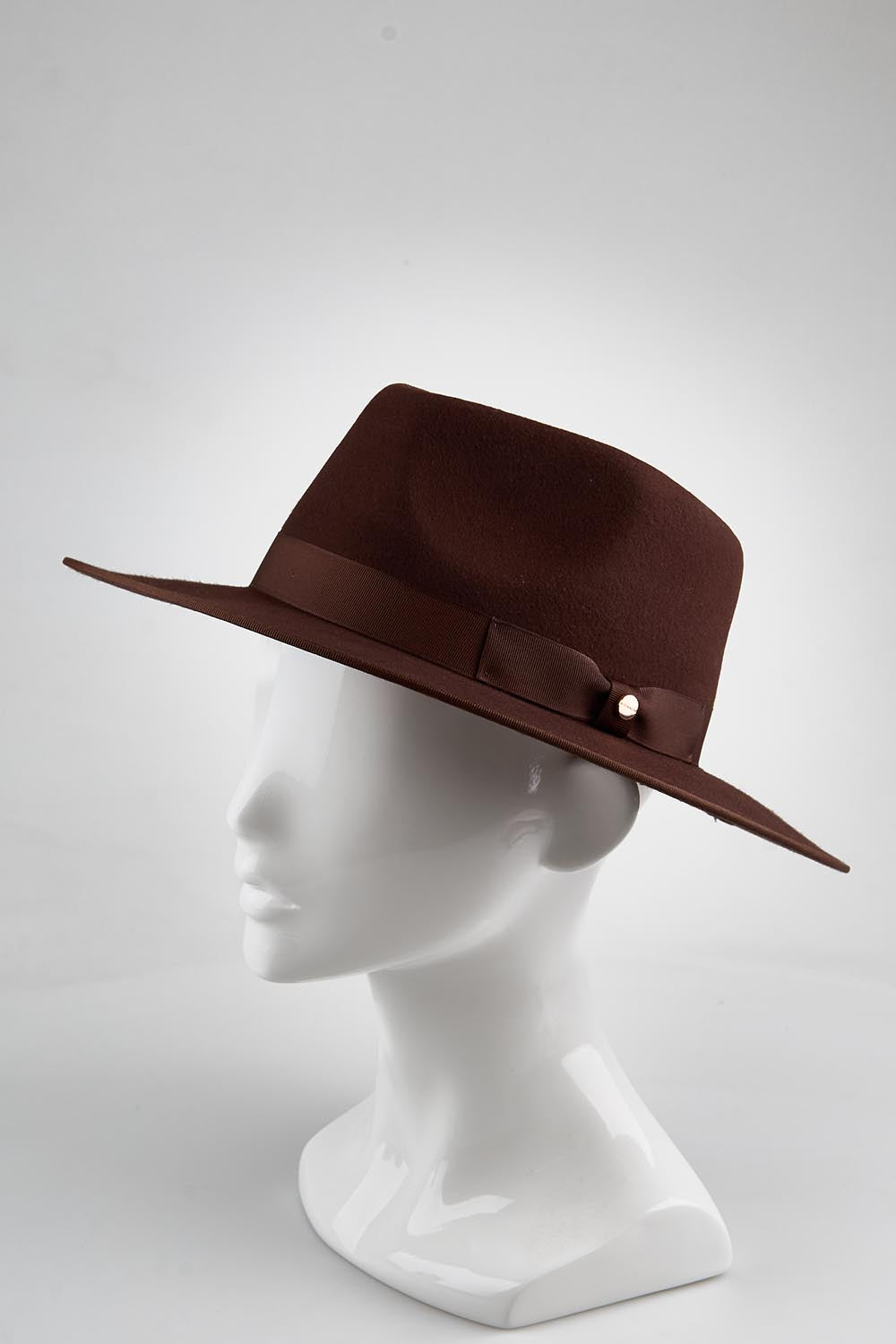 Model Genericm wearing size sample of the Tara Wool Fedora - Chocolate in colour Chocolate, from an angle