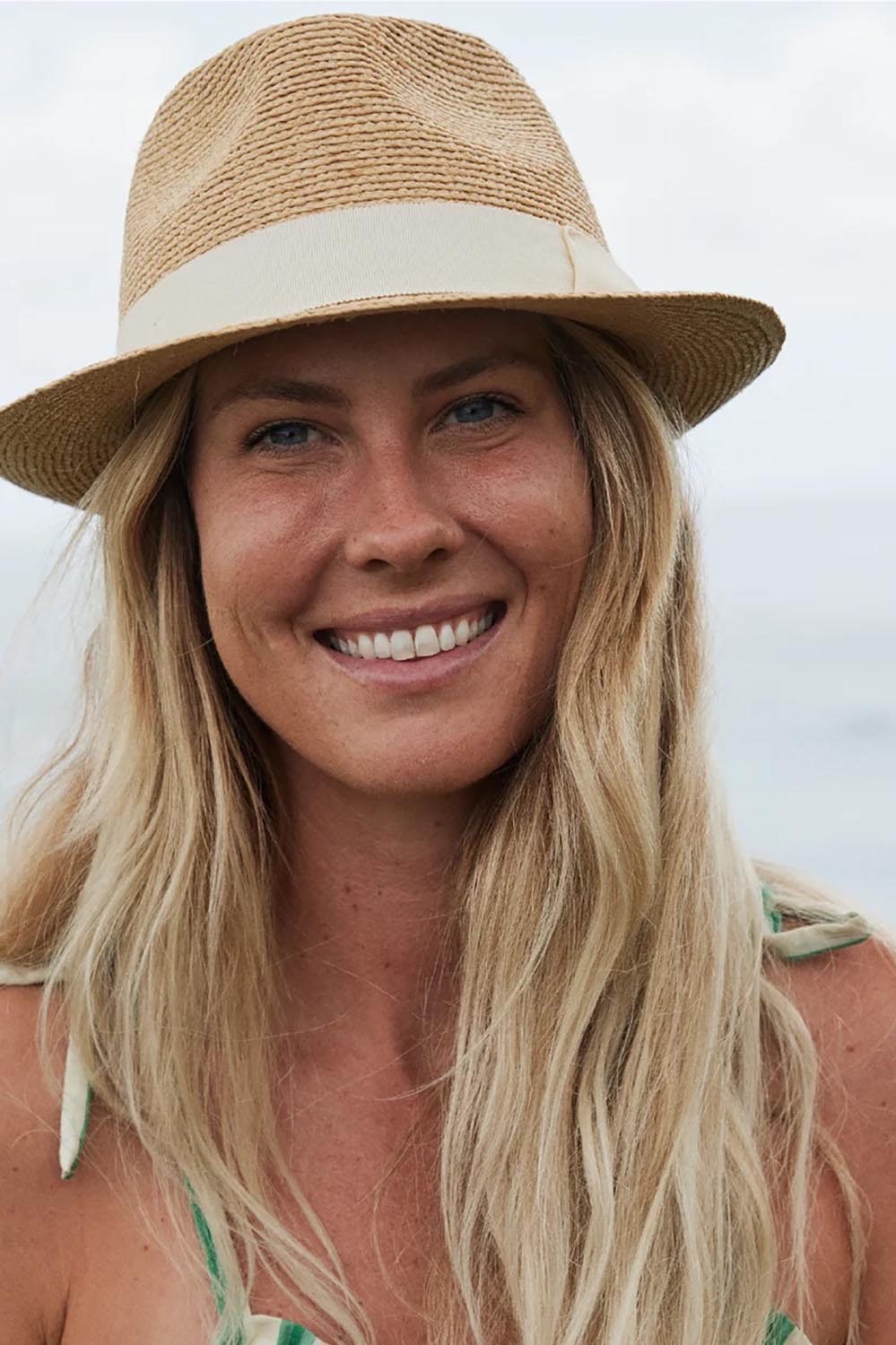 Product shot of the Palm Beach Raffia Packable Fedora - Naturalivory in colour Naturalivory, from the front