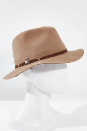 A model wearing the Matilda Mid Brim in colour Chocolate, from the front, showing the whole outfit