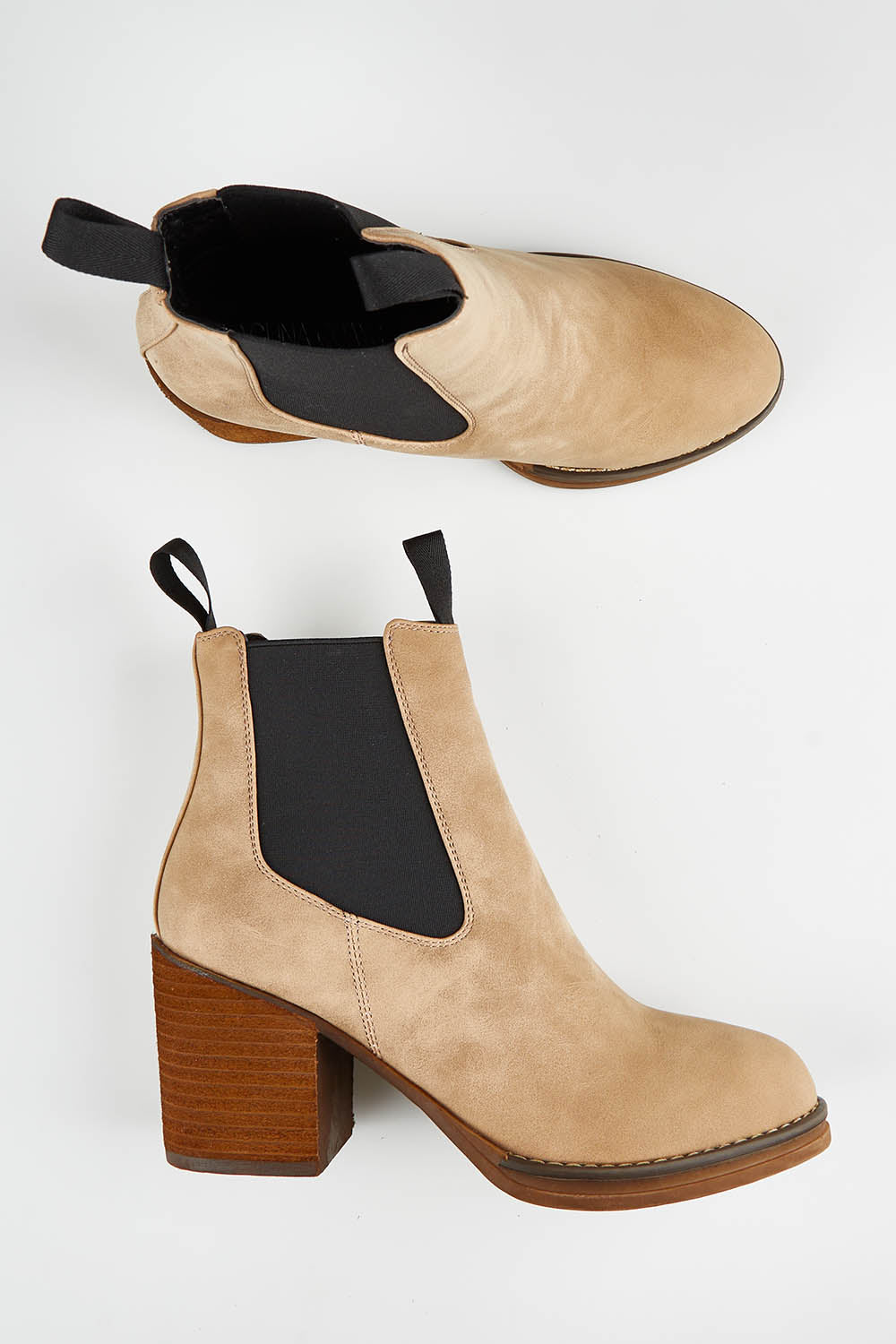 A model wearing size 36 of the Cleo Ankle Boot in colour Taupe, from the front, showing the whole outfit