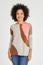 Model Olivia wearing size S of the Whirlwind Jumper in colour Earth, from the front, cropped image