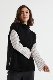 A model wearing the Lofty Tunic in colour Black (Black), from the front, cropped image