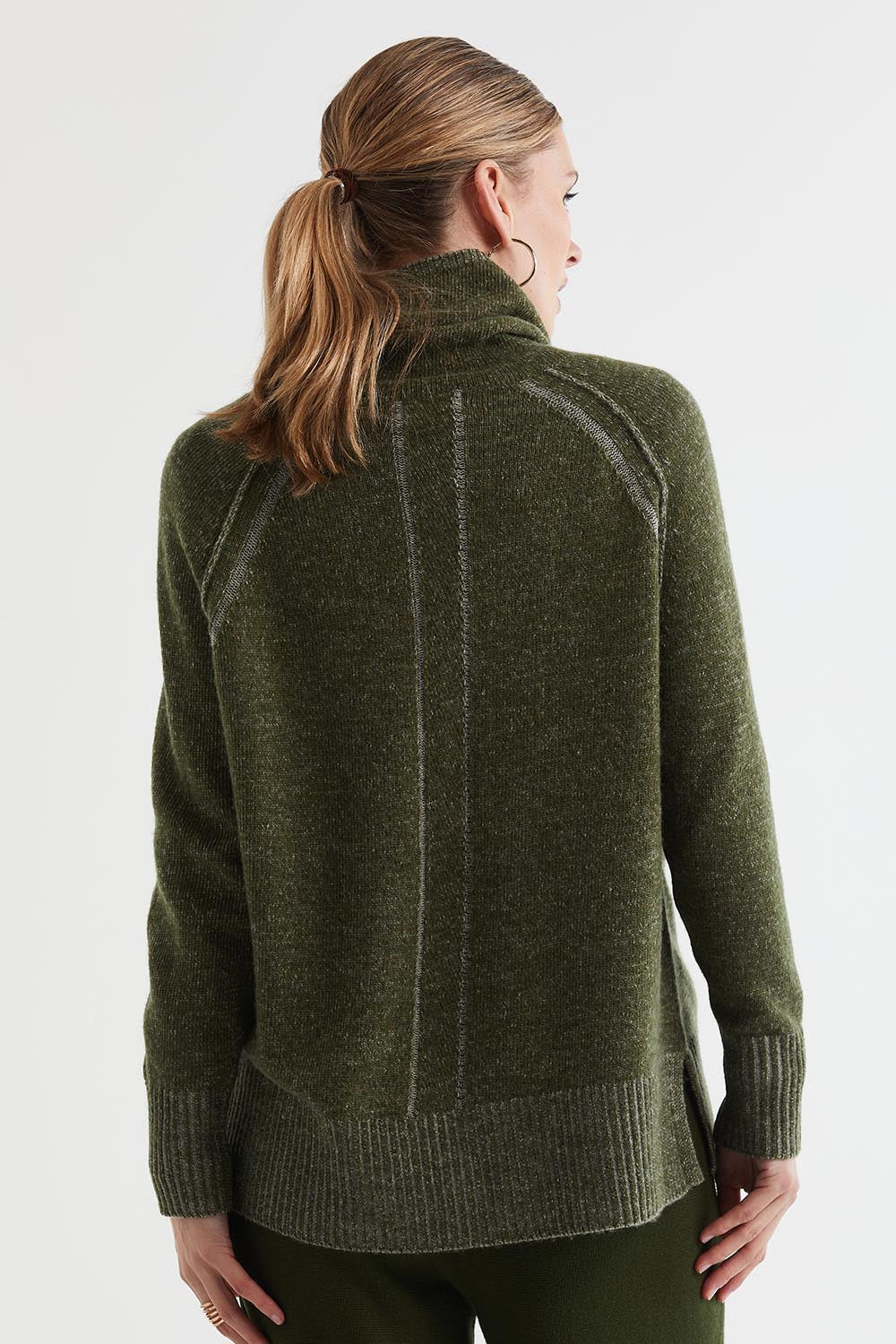 A model wearing the Twoin colourTone Lambswool Rollneck - Olive (Green), from the back