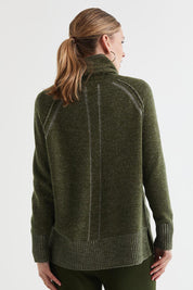 A model wearing the Twoin colourTone Lambswool Rollneck - Olive (Green), from the back