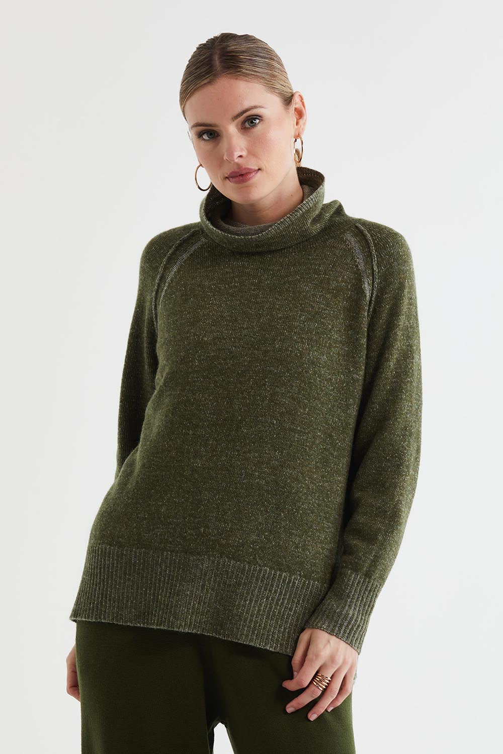 A model wearing the Twoin colourTone Lambswool Rollneck - Olive (Green), from the front, cropped image