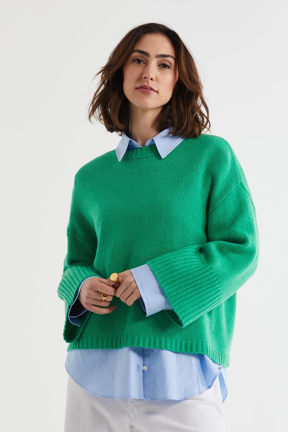 A model wearing the Wide Sleeve Lambswool Crew in colour Parakeet (Green), from the front, cropped image