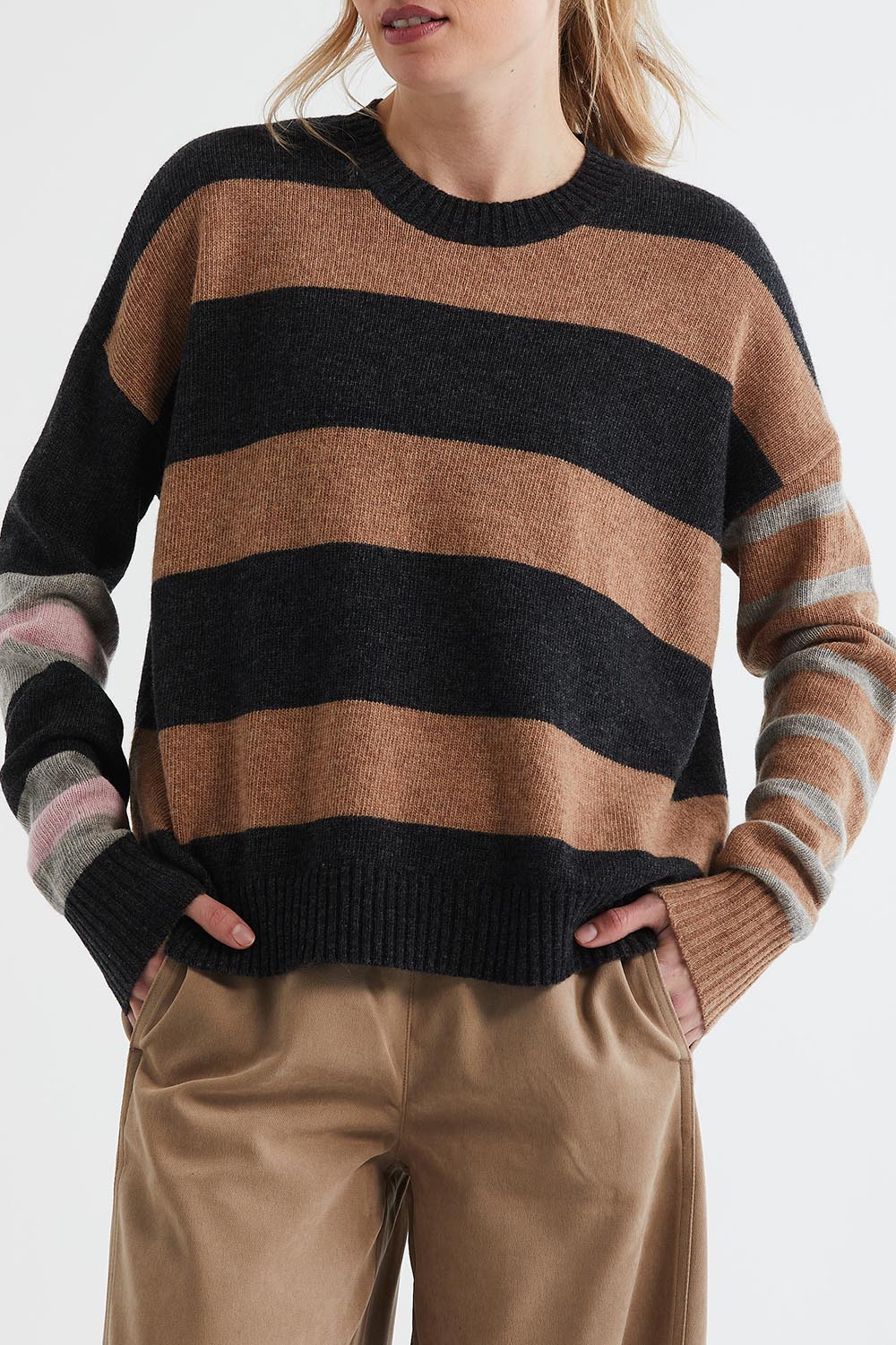 A model wearing the Lambswool Stripe Crew in colour Midnight, from the front, cropped image
