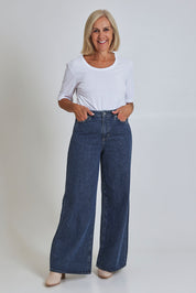 Model Sandy wearing size 10 of the Riders Mid Ain colourLine Wide Leg Jean - Bluehorizo (Blue), from the front, showing the whole outfit