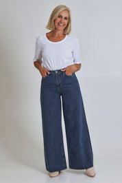Model Sandy wearing size 10 of the Riders Mid Ain colourLine Wide Leg Jean - Bluehorizo (Blue), from the front, showing the whole outfit