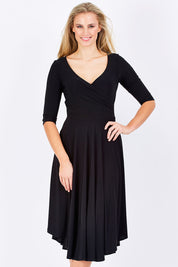 Model Maddy wearing size 10 of the Stella Dress in colour Black (Black), from the front, cropped image