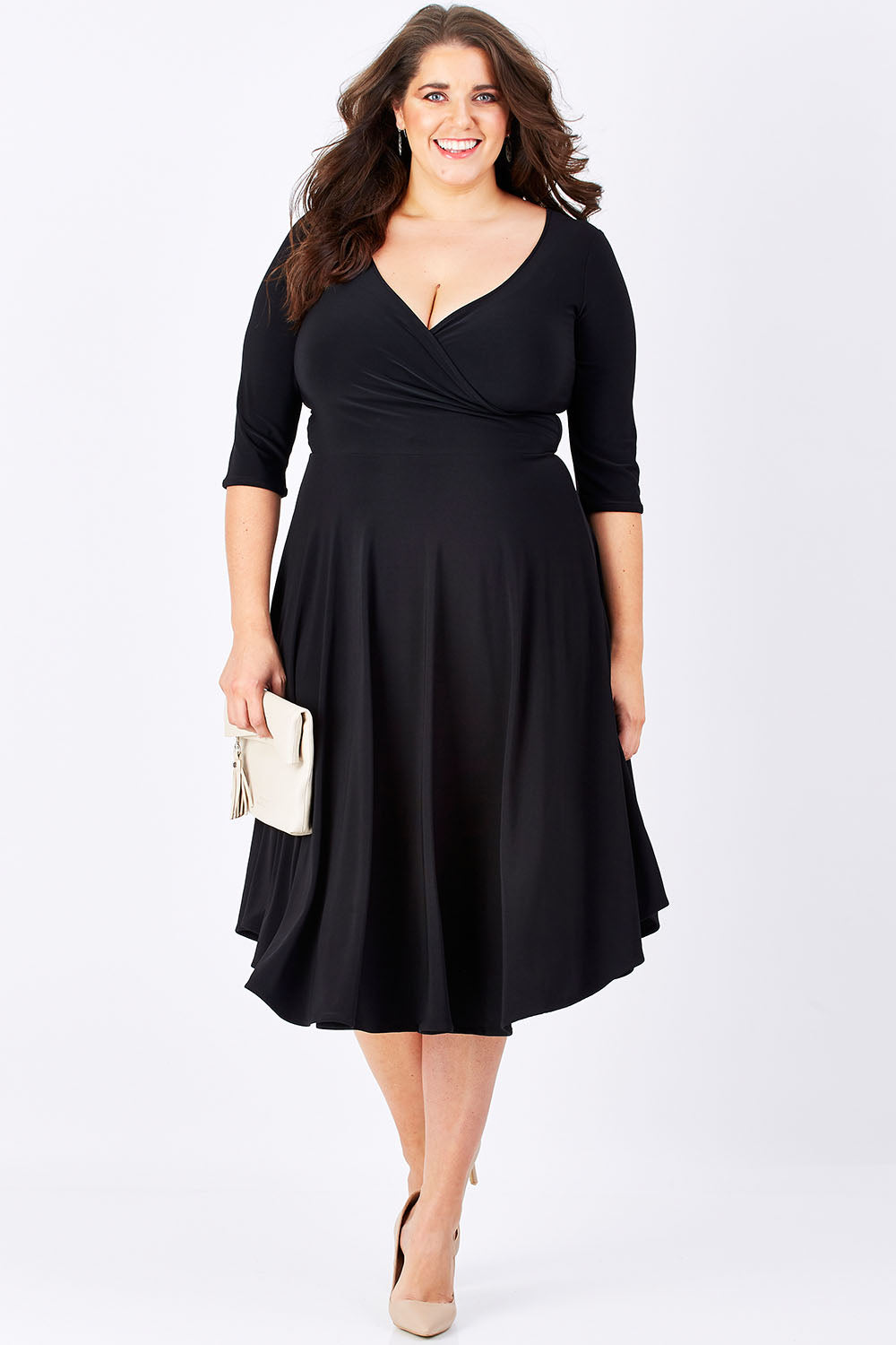 Model Mae wearing size 16 of the Stella Dress in colour Black (Black), from the front, showing the whole outfit