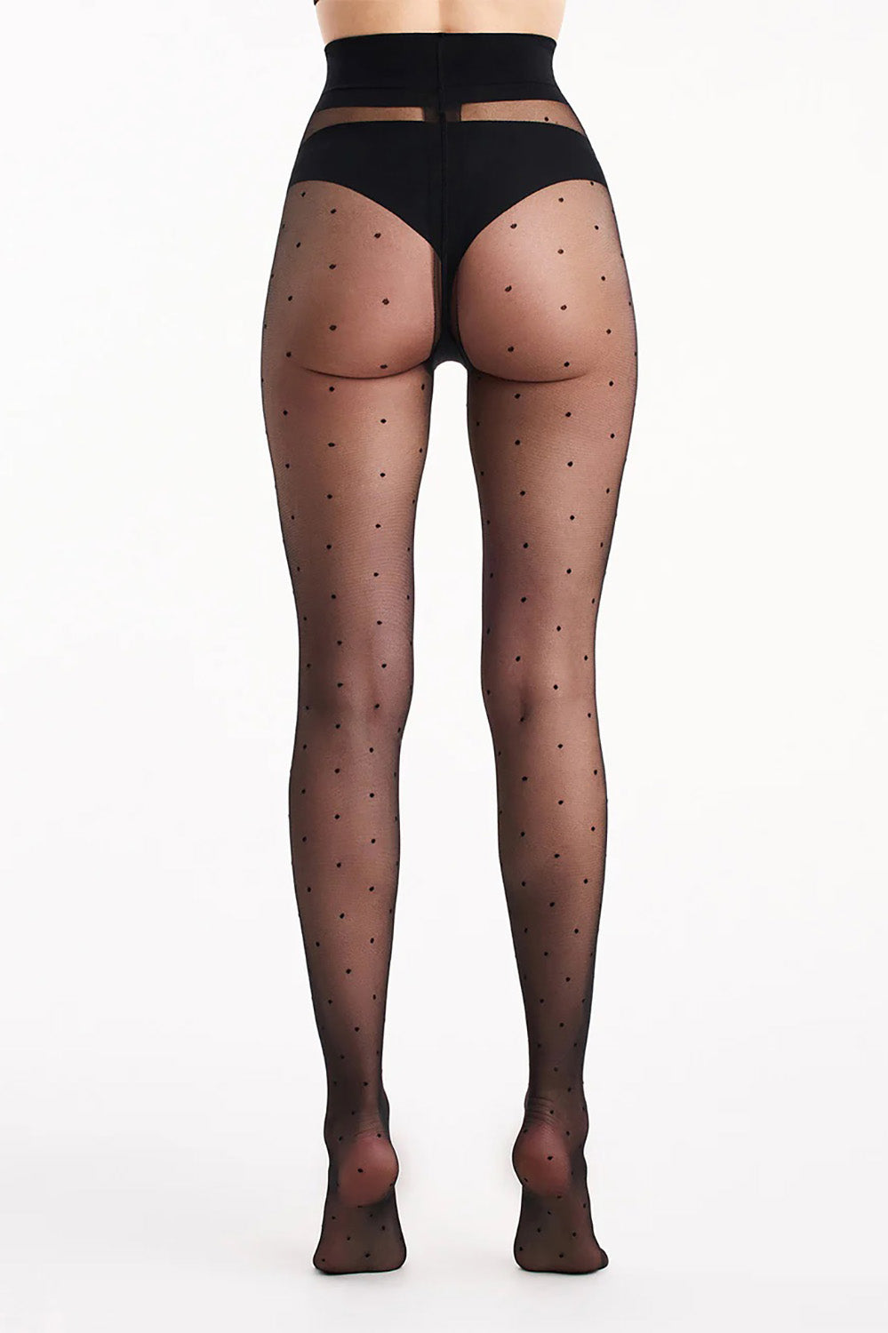 A model wearing the Sienna Spot Tight in colour Nerospot (Black), from the back