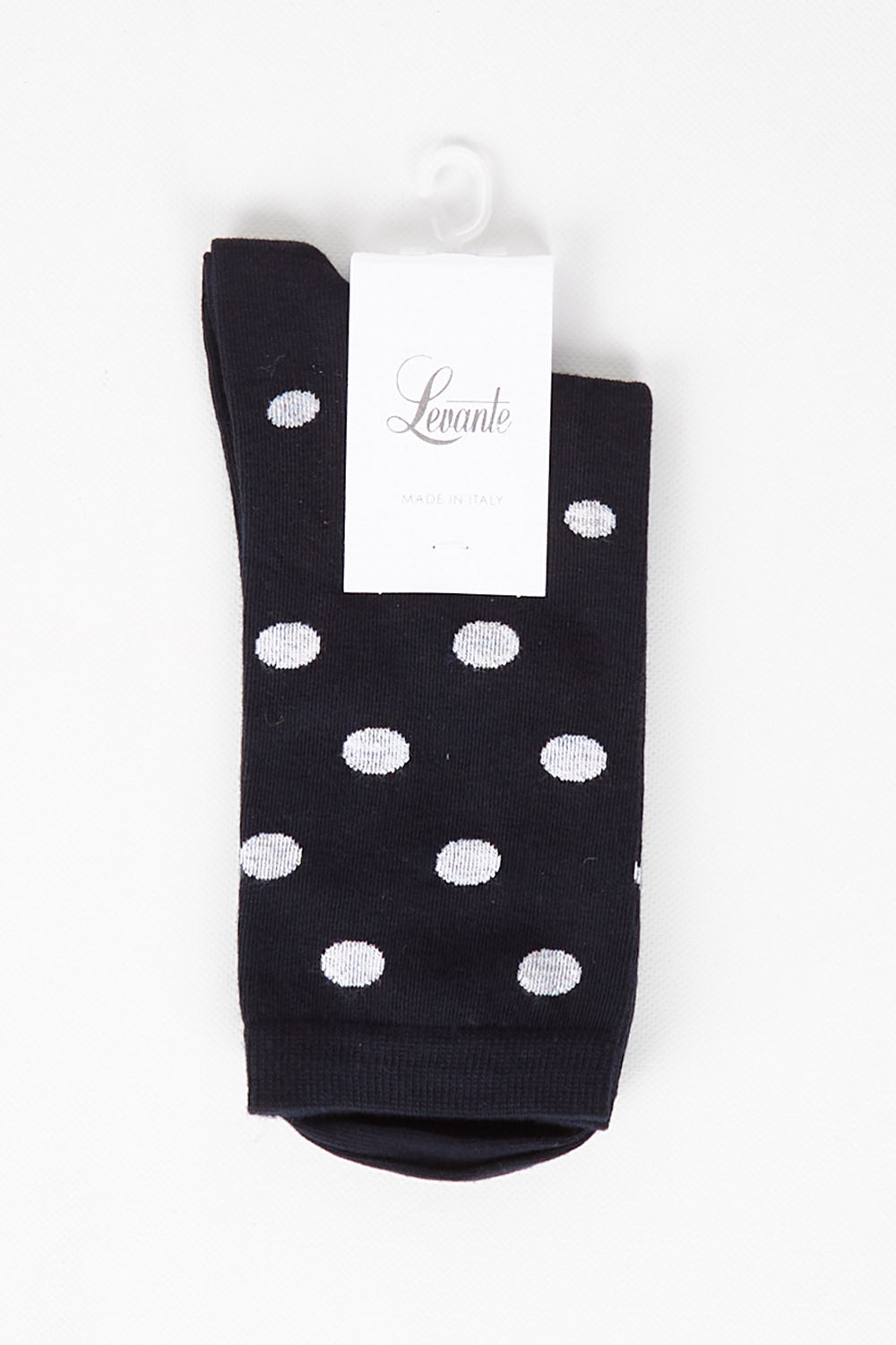 A model wearing size OneSize of the Gigi Spot Sock in colour Inkwhite (Blue), from the front, showing the whole outfit