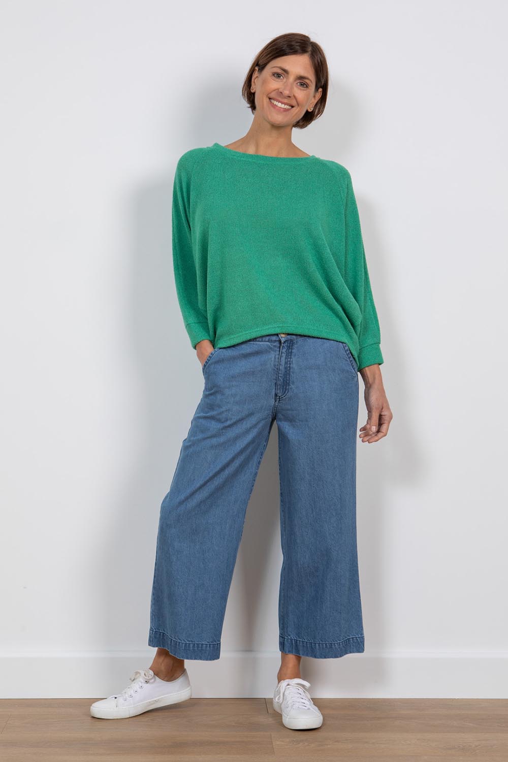 A model wearing the Ruby Crop Jeans in colour Denim (Blue), from the front, showing the whole outfit