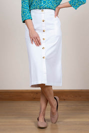 A model wearing the Orchard Skirt in colour White (White), from the front, cropped image