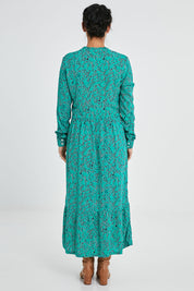 Model Katie wearing size 10 of the Valley Dress in colour Green (Green), from the back